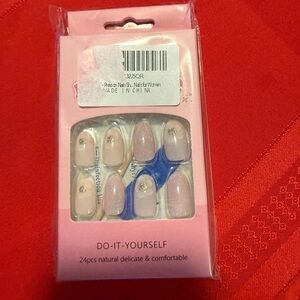 Manicure medium length pale pink press on nails with gold glitter dot on top
